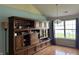 Stylish living room featuring a large built-in cabinet and a window that provides plenty of natural light at 11014 Lake Run Dr, Fishers, IN 46038