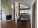 Open living room featuring a fireplace, hardwood floors, and vaulted ceiling at 11014 Lake Run Dr, Fishers, IN 46038