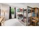 bedroom featuring a bunk bed, patterned curtains, and plenty of natural light from the window at 11041 Limbach Cir, Indianapolis, IN 46236