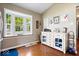 Bright breakfast nook with bay window, white hutch, and hardwood floors, creating a cozy dining space at 11041 Limbach Cir, Indianapolis, IN 46236