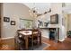 Bright dining area featuring stylish lighting, wood floors, and a convenient bar area at 11041 Limbach Cir, Indianapolis, IN 46236