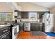 Spacious kitchen featuring stainless steel appliances, dark cabinetry, and ample counter space at 11041 Limbach Cir, Indianapolis, IN 46236