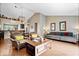 Open-concept living area with a view of dining area, stylish furniture, and natural light at 11041 Limbach Cir, Indianapolis, IN 46236