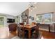 Bright living room with a brick fireplace, and view of the dining area at 11041 Limbach Cir, Indianapolis, IN 46236
