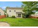 Exterior of home featuring a well maintained lawn, wood fence and mature trees at 11051 Oakridge Dr, Fishers, IN 46038