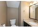 Well-lit bathroom with granite countertops, a dark vanity and modern fixtures at 11051 Oakridge Dr, Fishers, IN 46038