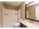 Bathroom featuring a bathtub and shower, granite vanity, and updated lighting at 11051 Oakridge Dr, Fishers, IN 46038