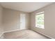 Neutral bedroom featuring carpet, beige walls, and a window for natural light at 11051 Oakridge Dr, Fishers, IN 46038