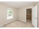 Neutral bedroom featuring carpet, beige walls, and natural light at 11051 Oakridge Dr, Fishers, IN 46038