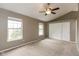 Spacious bedroom with high ceilings, ceiling fan, two windows and closet at 11051 Oakridge Dr, Fishers, IN 46038