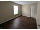 Cozy bedroom featuring wood floors, one window, and a bi-fold door closet at 11343 Congaree Way, Indianapolis, IN 46235
