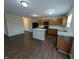 Open kitchen with an island, black appliances, and an eat-in area at 11343 Congaree Way, Indianapolis, IN 46235