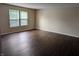 Inviting living room showcasing beautiful hardwood floors and well-lit ambiance at 11343 Congaree Way, Indianapolis, IN 46235