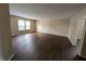 Bright and airy living room featuring sleek hardwood floors and abundant natural light at 11343 Congaree Way, Indianapolis, IN 46235