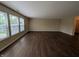Large living room with wood flooring and several windows for natural light at 11343 Congaree Way, Indianapolis, IN 46235