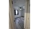 View of a bedroom from doorway with ceiling fan, window, and new floors at 1205 Meadow Ln, Lebanon, IN 46052