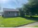 Charming single story home with well-maintained lawn, mature tree and neutral color at 1205 Meadow Ln, Lebanon, IN 46052