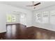 Inviting living room showcasing hardwood floors, arched doorway, and bright windows at 1209 W 22Nd St, Anderson, IN 46016
