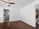 Living room featuring hardwood floors and an arched doorway to the kitchen at 1209 W 22Nd St, Anderson, IN 46016
