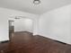 Spacious living room featuring hardwood floors and an arched entryway at 1209 W 22Nd St, Anderson, IN 46016