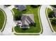 Aerial view of a home on a well-kept lawn featuring mature landscaping and a paved driveway leading to the property at 121 George Ct, Danville, IN 46122