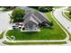 An aerial view showcases a well-manicured lawn, mature trees and a neatly paved driveway of the single-Gathering home at 121 George Ct, Danville, IN 46122
