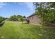 View of a large backyard and deck on a single-Gathering home at 121 George Ct, Danville, IN 46122