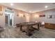 This finished basement features a pool table and unique wall art at 121 George Ct, Danville, IN 46122