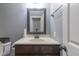 Powder room with a decorative mirror, a white countertop and a dark wood vanity at 121 George Ct, Danville, IN 46122