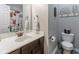 Bathroom featuring a white vanity, toilet, and shower with a modern shower curtain at 121 George Ct, Danville, IN 46122