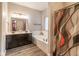 Bathroom features a double vanity, soaking tub, and a modern shower curtain for privacy at 121 George Ct, Danville, IN 46122