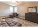 Bedroom with wood-look floors, ceiling fan, gray walls and modern furnishings at 121 George Ct, Danville, IN 46122