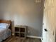 Bedroom featuring a wooden nightstand, wood floors, and white door at 121 George Ct, Danville, IN 46122