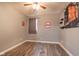 Spacious bedroom featuring wood-look floors, a ceiling fan, and eclectic decor at 121 George Ct, Danville, IN 46122