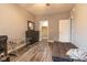 Bedroom featuring wood-look floors, gray walls, ceiling fan, dresser, and closet at 121 George Ct, Danville, IN 46122