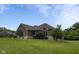A beautiful single-Gathering home boasts a well-manicured lawn and mature trees at 121 George Ct, Danville, IN 46122