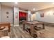 Game room with a pool table, movie poster, and wood-look floors at 121 George Ct, Danville, IN 46122