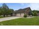 Spacious three car garage with brick exterior and lovely yard at 121 George Ct, Danville, IN 46122
