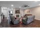 Comfortable living room with fireplace, ceiling fan and hardwood floors at 121 George Ct, Danville, IN 46122