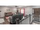 Living room featuring hardwood floors and stair access to a finished basement at 121 George Ct, Danville, IN 46122