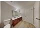 Bathroom with double vanity, dark cabinetry, and modern fixtures at 1305 Gleneagle Dr, Indianapolis, IN 46239