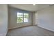 Neutral carpet and light gray walls provide a clean and modern backdrop in this well-lit bedroom at 1305 Gleneagle Dr, Indianapolis, IN 46239