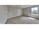 Bedroom with neutral carpet, closet with double doors and one window at 1305 Gleneagle Dr, Indianapolis, IN 46239