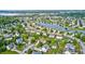 Stunning aerial view of a suburban neighborhood with a scenic lake and well-maintained homes at 1306 Flat Wood Ct, Brownsburg, IN 46112