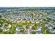 Beautiful aerial view of a suburban neighborhood with lush landscaping and a serene lake at 1306 Flat Wood Ct, Brownsburg, IN 46112