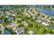 Beautiful aerial view of a suburban community with houses, trees, and a small lake at 1306 Flat Wood Ct, Brownsburg, IN 46112
