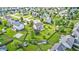 Aerial view of a residential neighborhood showcasing well-maintained homes and green spaces at 1306 Flat Wood Ct, Brownsburg, IN 46112