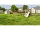 Spacious backyard featuring a swing set, slide, and storage shed, perfect for Gathering fun at 1306 Flat Wood Ct, Brownsburg, IN 46112