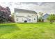 Expansive backyard with lush green grass and patio, ideal for outdoor entertaining and relaxation at 1306 Flat Wood Ct, Brownsburg, IN 46112