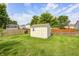 Backyard storage shed with double doors, perfect for storing gardening tools and lawn equipment at 1306 Flat Wood Ct, Brownsburg, IN 46112